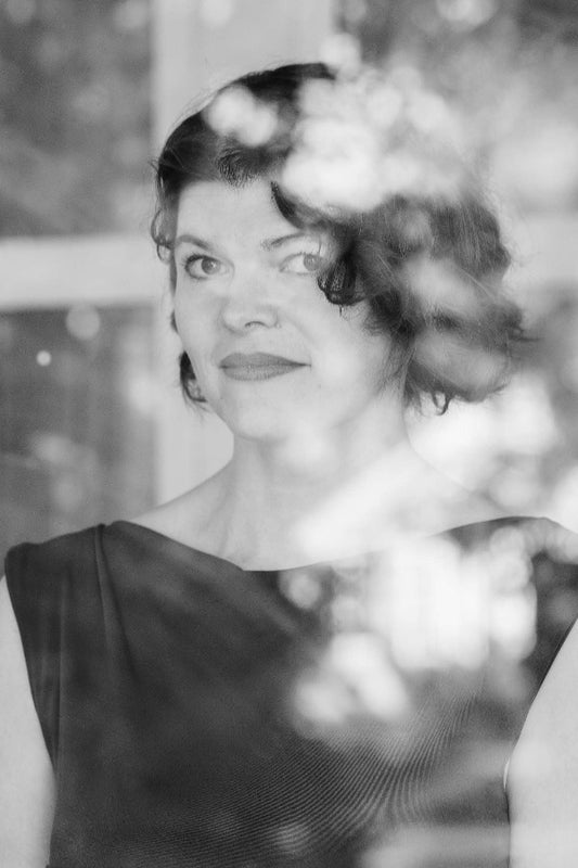 Black and white portrait of a woman with a blurred background